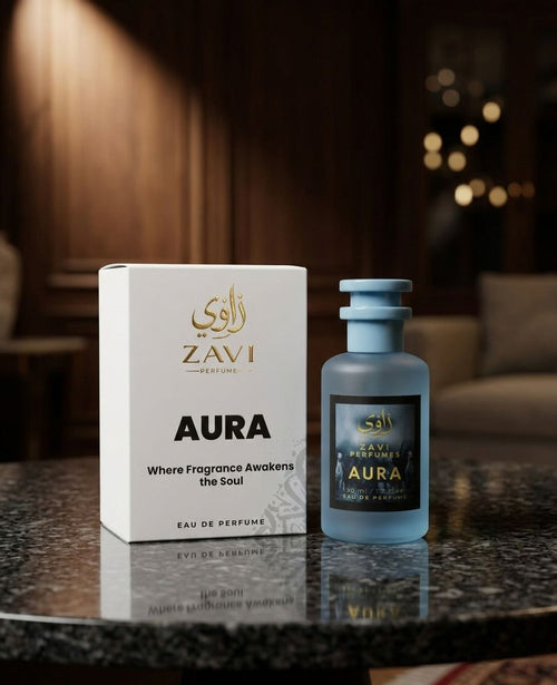 Zavi Aura perfume bottle and packaging on a reflective surface with a blurred background